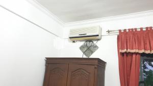 a room with a air conditioner on a wall at Castle Residence Syariah RedPartner in Siwalapkerto