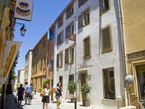 a group of people walking down a street at L'Hostalet in Argelès-sur-Mer