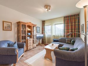 a living room with two couches and a table at Ferienwohnanlage Bergschlößl Wohnung Nr 9 in Oberaudorf