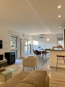 a living room with a couch and a table at San Martino Lake View Apartment in Ispra