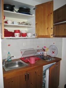 a kitchen with a sink and a counter top at Appartement d'une chambre a Bernex a 50 m des pistes avec balcon et wifi in Bernex