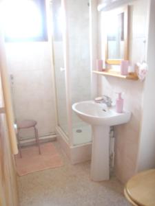 a white bathroom with a sink and a shower at Appartement d'une chambre a Bernex a 50 m des pistes avec balcon et wifi in Bernex