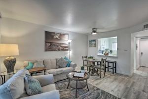 a living room with a couch and a table at 1 Mi to Old Town Scottsdale Condo with Pool Access in Scottsdale