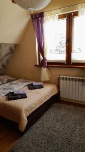 ザコパネにあるTatary - u Stanisławyのベッドルーム1室(枕2つ付)