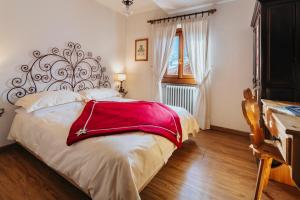 Postel nebo postele na pokoji v ubytování Hotel Panda Cortina- ricarica auto elettriche