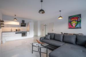 a living room with a couch and a table at My Apartment im Bremer Viertel in Bremen
