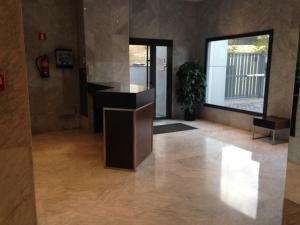 a living room with a counter and a large window at Bausa 19 in Madrid