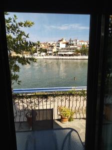 a view of a body of water from a window at Ilio Socrates in Skala Marion