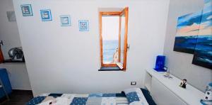 Postel nebo postele na pokoji v ubytování Double room "Dora" - La Scogliera