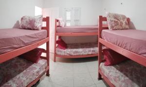 Ένα ή περισσότερα κρεβάτια σε δωμάτιο στο Pousada & Hostel Frida +22 φωτογραφίες