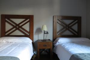 Postel nebo postele na pokoji v ubytování Apartamentos Casa Pochetas