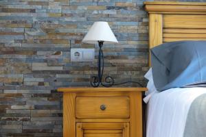 Postel nebo postele na pokoji v ubytování Apartamentos Casa Pochetas