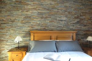 Postel nebo postele na pokoji v ubytování Apartamentos Casa Pochetas