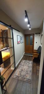 Et opholdsområde på APARTAMENT POD ŚLIWKAMI