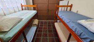 Postel nebo postele na pokoji v ubytování Hostel Caxias do Sul + 10 fotografií
