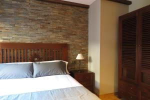 Postel nebo postele na pokoji v ubytování Apartamentos Casa Pochetas
