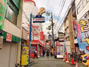a city street with people walking down the street at Union Shin-Osaka 3F - Vacation STAY 12037 in Osaka