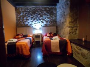 Postel nebo postele na pokoji v ubytování Apartamentos El Rincon Encantado + 37 fotografií