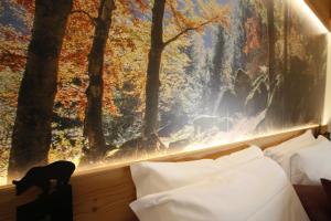 Łóżko lub łóżka w pokoju w obiekcie Hotel Petit Tournalin
