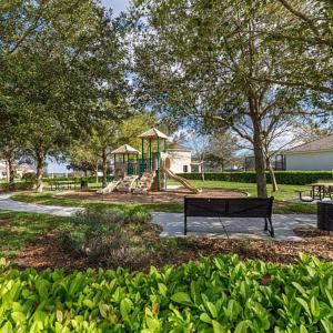 a park with a bench and a playground at Condominium Apartment Close to Disney in Orlando Florida in Orlando
