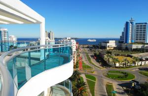 a view of a city from the balcony of a building at Categoría, excelente ubicación y full amenities! in Punta del Este