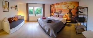 Ein Bett oder Betten in einem Zimmer der Unterkunft Ferienwohnung Eschenberg