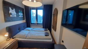 Posteľ alebo postele v izbe v ubytovaní Dom Minimal House