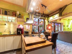 a kitchen with a table and chairs in a room at Ferienwohnung mit Wintergarten in Wismar in Wismar