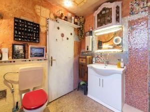 a small bathroom with a toilet and a sink at Ferienwohnung mit Wintergarten in Wismar in Wismar +32 photos