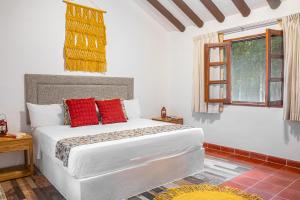 Postel nebo postele na pokoji v ubytování Hacienda San Miguel Yucatan