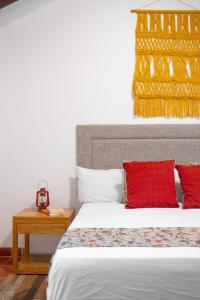 Postel nebo postele na pokoji v ubytování Hacienda San Miguel Yucatan