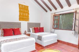 Postel nebo postele na pokoji v ubytování Hacienda San Miguel Yucatan