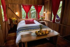 Postel nebo postele na pokoji v ubytování Casa Divina Eco Lodge