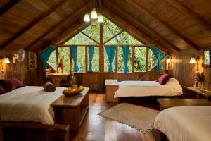 מיטה או מיטות בחדר ב-Casa Divina Eco Lodge