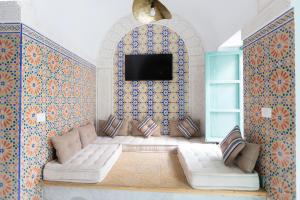 Postel nebo postele na pokoji v ubytování Dar Hammamet Guest House & Hammam