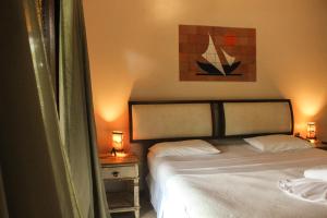 Cama ou camas em um quarto em Pousada Villa Bella