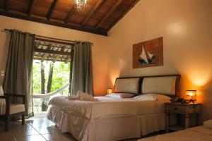 Cama ou camas em um quarto em Pousada Villa Bella