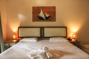 Cama ou camas em um quarto em Pousada Villa Bella