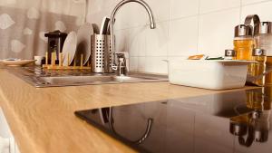 a kitchen with a counter with a sink and a counter top at The Dream in Massa Lubrense +21 photos