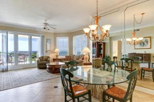 a living room with a glass table and chairs at Ocean Place II in Fernandina Beach