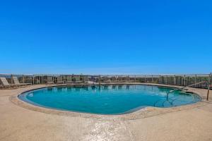 a large swimming pool in the middle of a beach at Ocean Place in Fernandina Beach