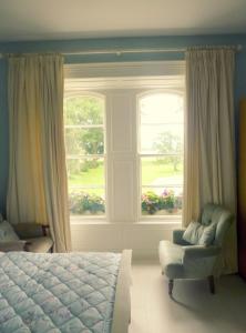 מיטה או מיטות בחדר ב-Riversdale Country House