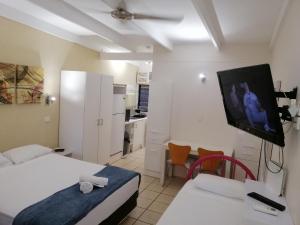 A television and/or entertainment center at Magnetic Island Resort, Sleeps 3, Free WIFI