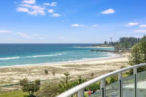 a beach with a view of the ocean at Kirra Surf Apartments in Gold Coast