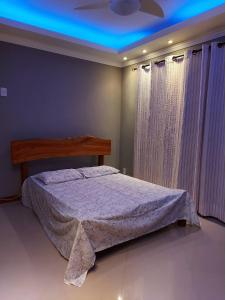 Ένα ή περισσότερα κρεβάτια σε δωμάτιο στο Casa dos sonhos - Alto Padrão