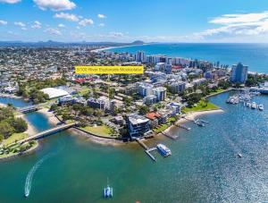 an aerial view of a city with a harbor at Excellsior Apartments in Mooloolaba
