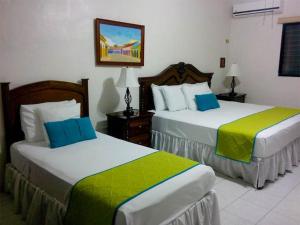 En eller flere senge i et værelse på Hotel Casa Blanca by Rotamundos