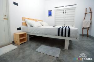 Postel nebo postele na pokoji v ubytování Mahagedara Dickwella