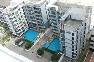 an overhead view of apartment buildings with a pool at NEOcondo @ PATTAYA in Jomtien Beach