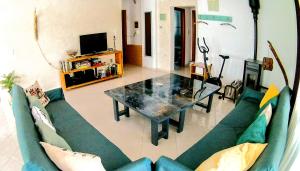 a living room with a couch and a table at Philoanesi in Neokaisáreia